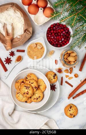 Freshly baked homemade Christmas cookies with cranberries, almonds, white chocolate, cinnamon and star anise. Delicious festive biscuit. Gingerbreads. Stock Photo