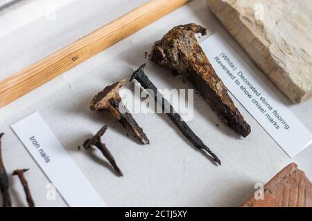 Old metal nails excavated from a Roman Villa site in West Sussex, England. On display in a museum. Stock Photo