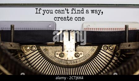Text 'if you can not find a way, create one' typed on retro typewriter. Business concept. Beautiful background. Stock Photo