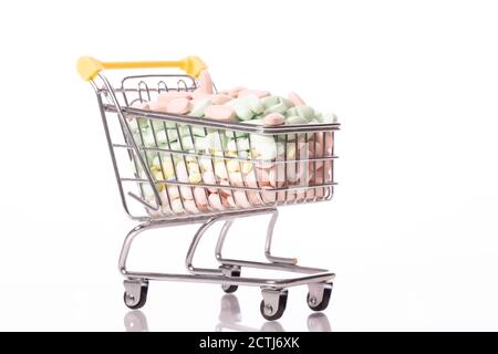 small shopping cart full of pills, medical concept, protection against disease Stock Photo