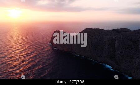 Lantern Cap de Formentor, pink colored sunrise over Lighthouse At Cape Formentor In Coast Of North Mallorca, Spain. . High quality photo Stock Photo