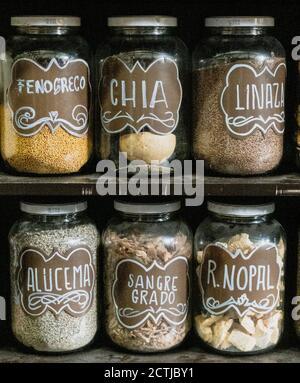 Jars on a store shelf labled with various spices. Stock Photo