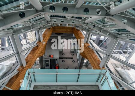 High-angle view of the interior of Pointe Helbronner station of Skyway Monte Bianco cableway with a staffer wearing a Covid-19 mask, Courmayeur, Italy Stock Photo