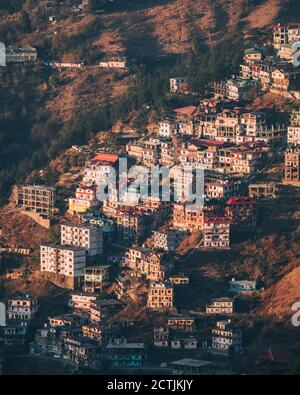 Shimla village high angle view at Sunset, houses at the foothills of the Himalayas, Himachal Pradesh Stock Photo