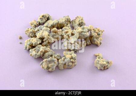 White chocolate cookies and cream candy clusters on lavender background Stock Photo