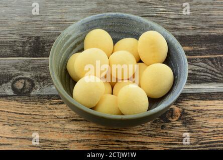Queso cheese and cassava bread balls snack in bowl on table Stock Photo