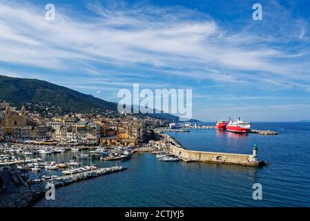 France, Haute-Corse, Bastia, Harbor of coastal town with cruise ship in background Stock Photo