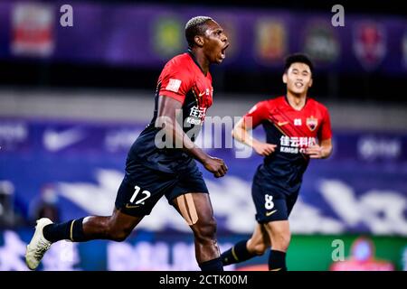 Cameroonian football player John Mary of Shenzhen F.C., left, celebrates after scoring a goal during the sixth-round match of 2020 Chinese Super Leagu Stock Photo