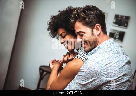 Close-up of romantic couple embracing while dancing in bar