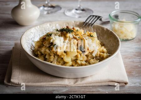 Bowl of ready-to-eat barley risotto with salsify Stock Photo