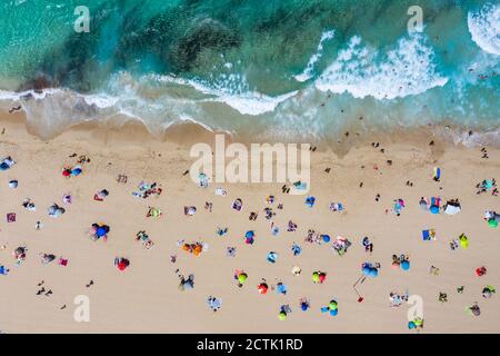 Spain, Mallorca, Cala Mesquida, Aerial view of people relaxing on Cala Agulla beach in summer Stock Photo