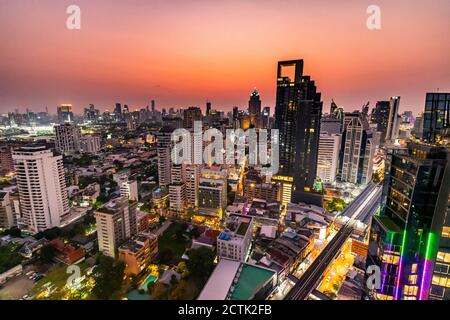 Thailand, Bangkok, Aerial view of capital city downtown at dusk Stock Photo