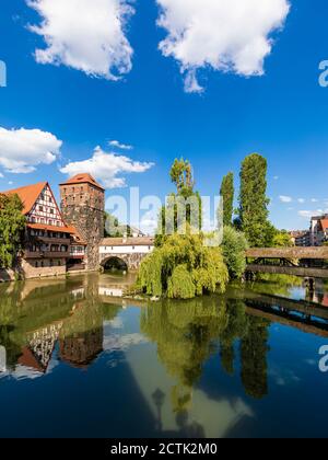 Germany, Bavaria, Nuremberg, River Pegnitz, Weinstadel and Wasserturm on sunny day Stock Photo