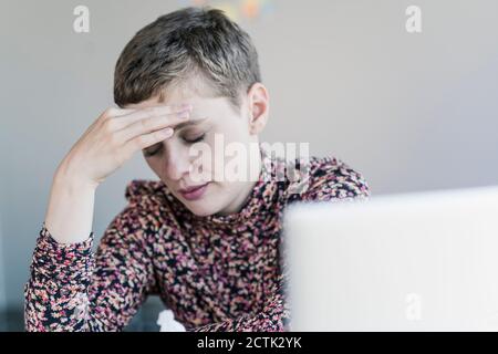 Portrait of businesswoman having headaches Stock Photo