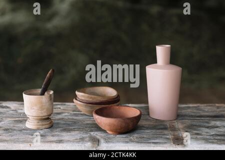 Close-up of earthenware on wooden table Stock Photo