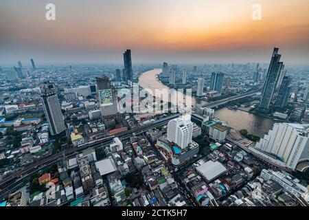 Thailand, Bangkok, Aerial view of capital city downtown at sunset Stock Photo