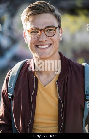 Smiling handsome young man wearing eyeglasses Stock Photo