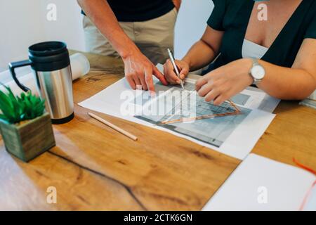 Business colleagues discussing on design at desk in office Stock Photo
