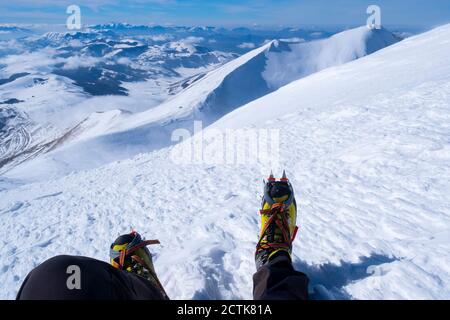 Low section of young man wearing hiking boot on Mount Vettore, Umbrian, Italy Stock Photo