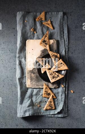Studio shot of homemade sourdough crackers with basil seeds Stock Photo