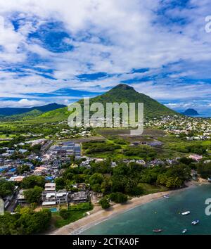 Mauritius, Black River, Tamarin, Helicopter view of coastal village with Tourelle du Tamarin mountain in background Stock Photo