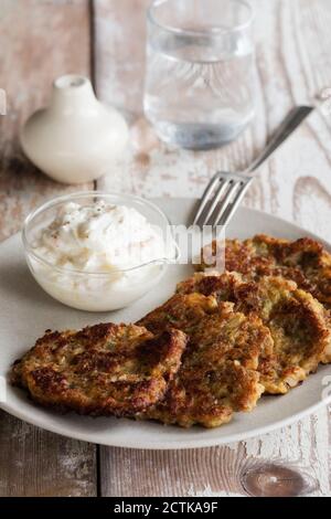 Rye and turnip pancakes with sour cream-yogurt dipping sauce Stock Photo