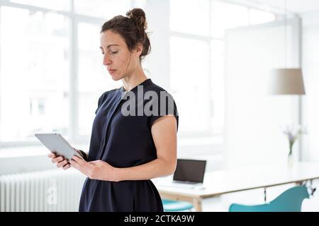 Female entrepreneur using digital tablet Stock Photo