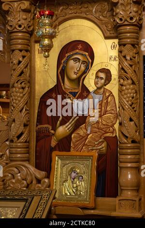 Orthodox icon on a church iconostasis. When worshipers enters the church they will kiss this icon and cross themselves. Stock Photo