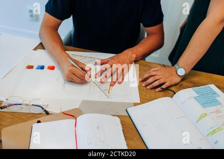 Colleagues working on new project at office Stock Photo