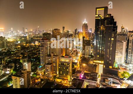 Thailand, Bangkok, Aerial view of capital city downtown at night Stock Photo