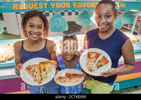 Sevierville Tennessee,Mr. Gatti's Buffet Style Pizza & Games,restarant interior inside,sliced slices,Black African Africans family sisters siblings gi