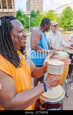 Huntsville Alabama,Big Spring Park,Black African man men friends play playing conga drums, Stock Photo