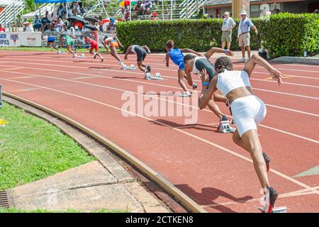Miami Florida,Tropical Park,USA Track & Field National Junior Olympics,student students athletes teen teens teenagers girls female race start runners Stock Photo