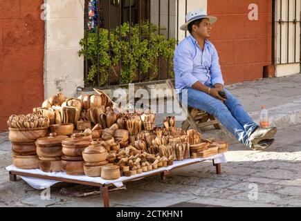 Oaxaca, Mexico - 2019-11-16 - Street vendor selling wooden kitchen bowls and utensils. Stock Photo