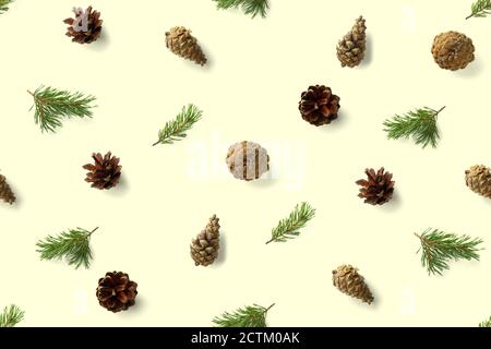 seamless christmas pattern from Pine cones on yellow background. modern pine cone christmas collage. Print for paper, fabric, wallpaper pinecones Stock Photo