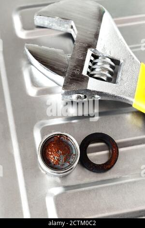 Dirty filter from kitchen faucet. The concept of cleaning and caring for household plumbing. Stock Photo