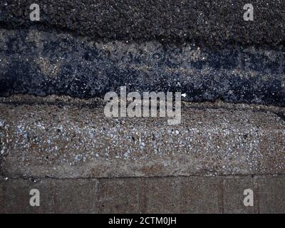 Closeup shot of old sidewalk and road asphalt Stock Photo