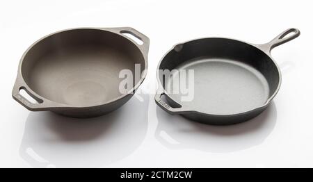Top View of Seasoned Cast Iron Skillet on White Background Stock Photo