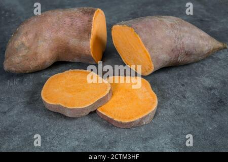 sweet potatoes isolated on a gray background Stock Photo