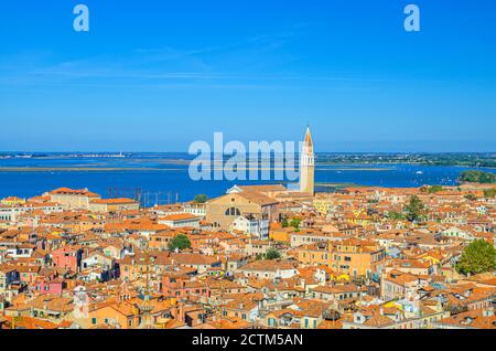 Aerial view of Venice city old historical centre with bell tower campanile, red tiled roofs buildings and islands in Venetian lagoon background, Veneto Region, Northern Italy Stock Photo