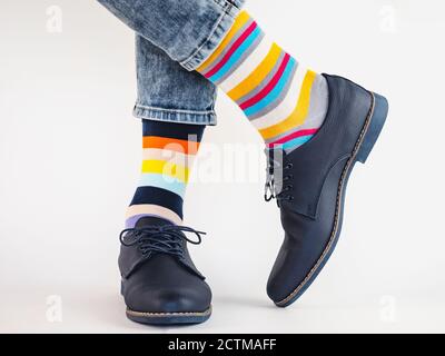 Men's legs, trendy shoes and bright socks Stock Photo