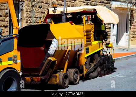 Asphalt Paving Machine on Construction Site Stock Photo