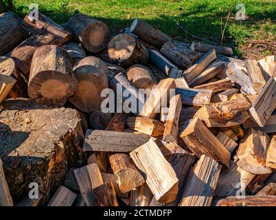 Wood chopped with an ax for heating a rural house. Stock Photo