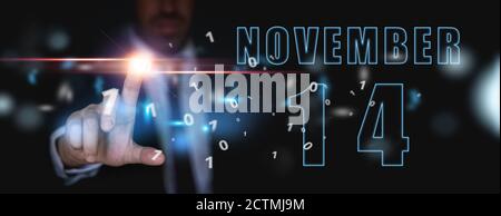 november 14th. Day 14 of month, announcement of date of business meeting or event. businessman holds the name of the month and day on his hand. autumn Stock Photo