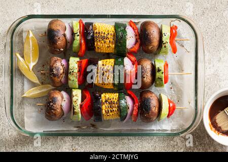 Preparing vegan kebab with variety of vegetables and shiitake mushrooms.top view Stock Photo