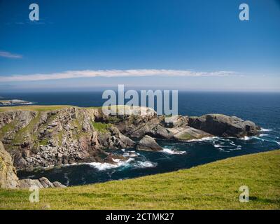 Steeply inclined eroded rock strata on Funzie Ness on the island of Fetlar in Shetland, Scotland, UK - Rocks in this area are of the Muness Phyllites Stock Photo