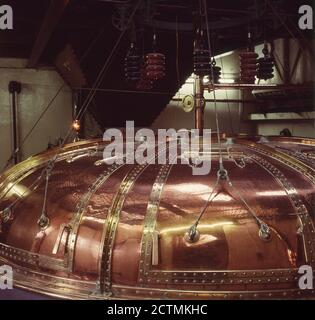 1960s, historical, Whisk making, large antique copper mash tun, Scotland. Stock Photo