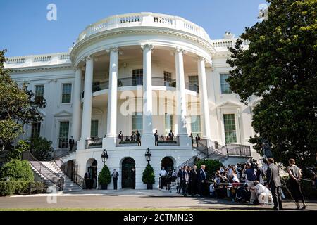 President Trump Travels to Texas. President Donald J. Trump, joined by Treasury Secretary Steven Mnuchin and Chief of Staff Mark Meadows, talks to members of the press on the South Lawn of the White House Wednesday, July 29, 2020, prior to boarding Marine One to begin his trip to Texas. Stock Photo
