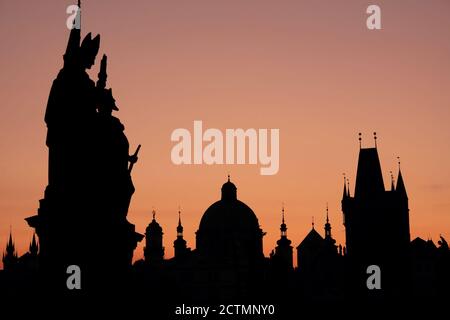 Silhouettes of ancient European buildings on a pink sky background. Stock Photo