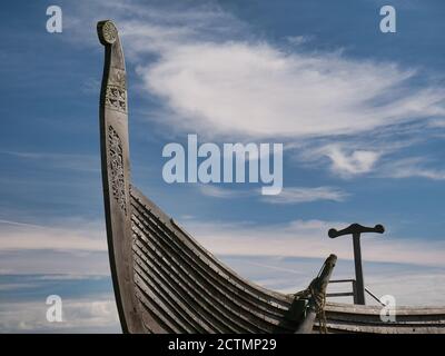 On a sunny day with light cloud, the prow of the Skidbladner - a full size replica of a Viking ship on show near Haroldswick on the island of Unst in Stock Photo